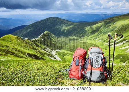 Backpacks in the mountains with views of the mountains.