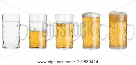 Five Glass Mugs With Beer Sorted From Empty To Full