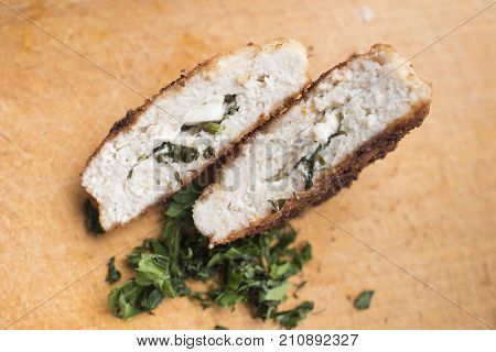 Cordon blue and greenery  on a wooden background