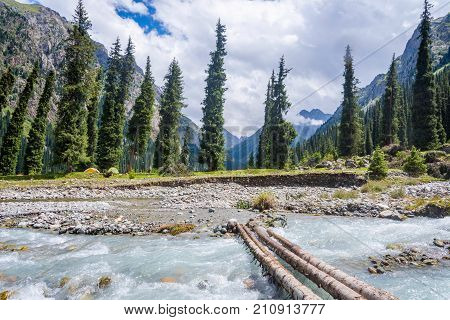 Bridge Over The River In Karakol National Park