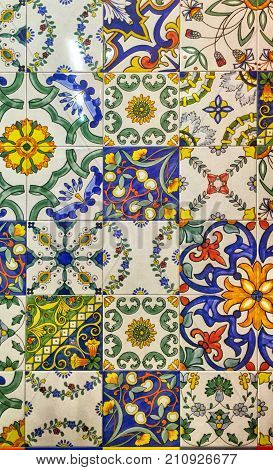 Detail of the traditional decorative tiles with majolica patterns. Spain traditional tiles. Floral ornament.