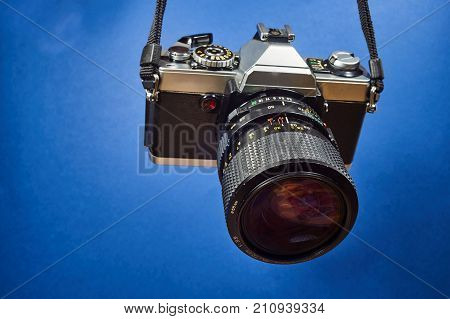 old Analog photo camera type SLR with lens