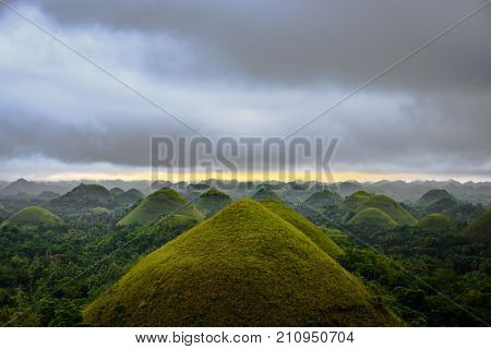 Scenic View Of The Unesco Site Of Chocolate Hills In Bohol, Philippines, With Clouds And Sun