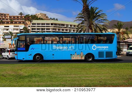 Jandia, Fuerteventura, Canary Islands, Spain - October 20, 2017: Blue Thalasso n1 voyages touring car passing by in the city of Jandia.