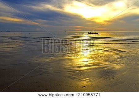 The beach Thung Wua Lan Beach idyllic silhouette with sunrise at Chumphon Province Thailand is famous for travel