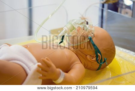 dummy mannequin baby child oxygen mask close-up