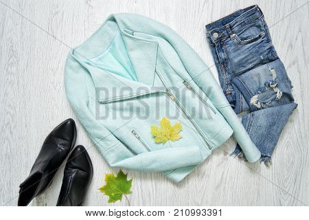 Mint Jacket, Black Shoes, Jeans And Maple Leaves. Fashionable Concept