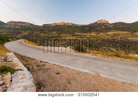 Road To Small Village Trstenik In Peljesac Peninsula, With Mountins And Blue Sky As Background