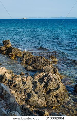 Beautiful Summer Seascape With Lighthouse On The Island In Orebic, Peljesac Peninsula, Dalmatia, Cro