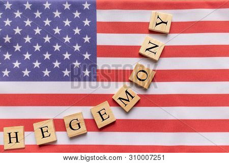 Concept Of Us Hegemony, Hegemony In Wooden Block Letters On Us Flag