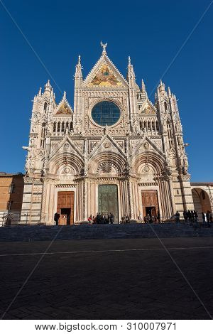 Facade Of The Siena Cathedral, Santa Maria Assunta 1220-1370 With Clear Blue Sky. Tuscany, Italy, Eu