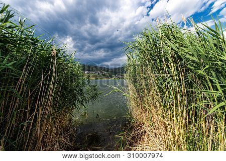 Serraia Lake (lago Della Serraia) And The Small Town Of Baselga Di Pine, Italian Alps, Trento Provin