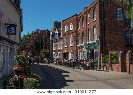 Beccles, United Kingdom - June 22, 2019: People Enjoying Food And Drink Sat Outside The Kings Head H