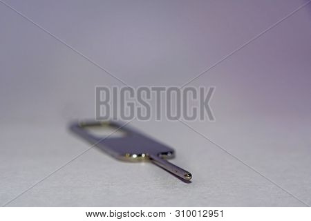 Close Up Of Nano Sim Card Ejector On White Background