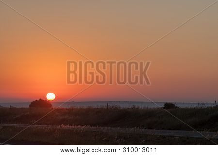 The Sun Is Rising Over Road N1 Just North Of Bloemfontein, South Africa