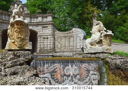 Salzburg, Austria - May 25, 2019 : Trick Fountains And Sculptures At The  Public Gardens Of Hellbrun