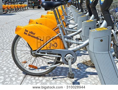 Brussels, Belgium - July 25, 2018. Villo Bicycles Parked In The Bicycle Sharing Station On Street. P