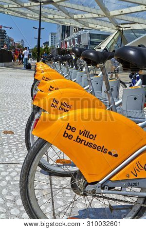 Brussels, Belgium - July 25, 2018. Villo Bicycles Parked In The Bicycle Sharing Station On Street. P