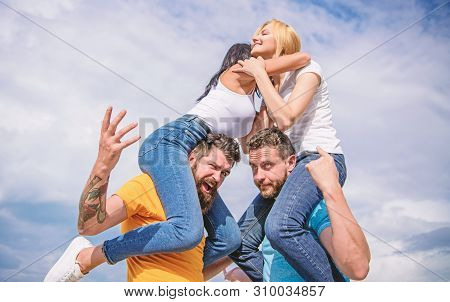 Friendship Of Families. Couples In Love Having Fun. Men Carry Girlfriends On Shoulders. Summer Vacat