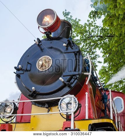 Old Soviet Steam Locomotive Blowing Off The Steam Out Of The Whistle