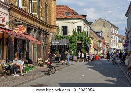 People Drinking On A Street Bar Of Aarhus On Denmark