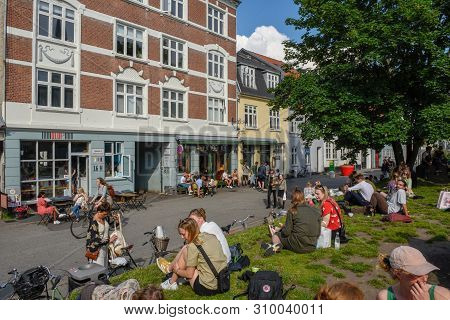 People Drinking On A Street Bar Of Aarhus On Denmark