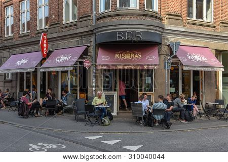 People Drinking On A Street Bar Of Aarhus On Denmark
