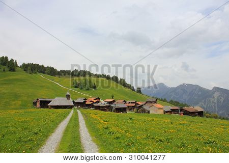 Swiss Village Situated High Up On A Hill Top. Early Summer.