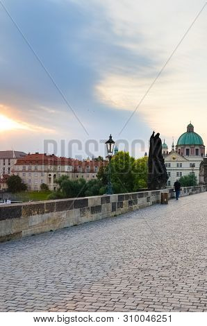 Prague, Czech Republic - June 27th 2019: Historical Charles Bridge In The Early Morning In Sunrise L