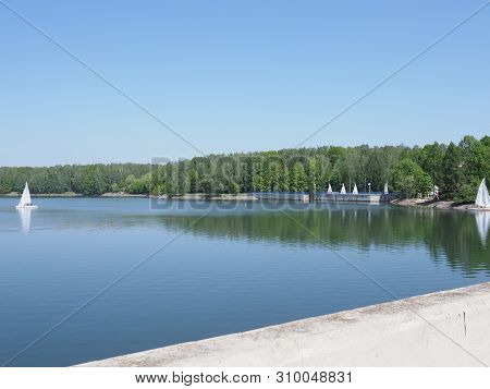 Wall And Two Yachts On Landscapes Of Artificial European Reservoir In Goczalkowice In Poland With Cl