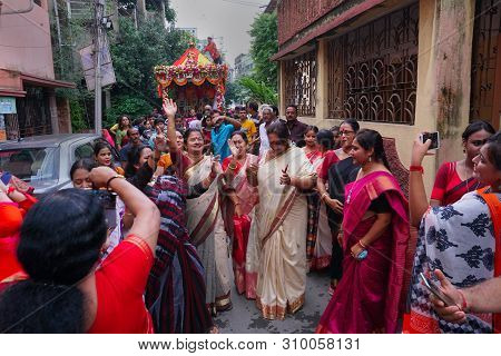 Howrah, West Bengal , India - July 22nd 2018 : Bengali Hindu Sari Clad Devotee Ladies Dancing In Joy