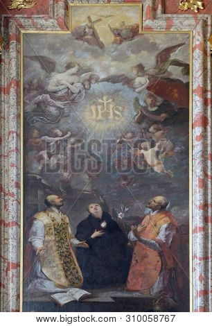 LUCERNE, SWITZERLAND - JUNE 24, 2018: St. Ignatius of Loyola, St. Stanislaus and St. Francis Borgia, Saint Ignatius altar in Jesuit church of St. Francis Xavier in Lucerne, Switzerland