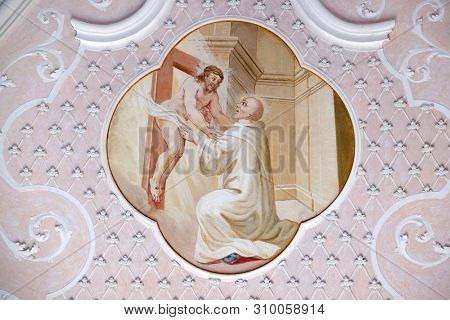 BRONNBACH, GERMANY - JULY 07, 2018: Ceiling frescoes with scenes from the life of St. Bernard of Clairvaux by Johann Adam Remele in Bernard Hall, Cistercian Abbey of Bronnbach in Reicholzheim, Germany