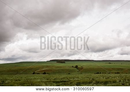 Bad Weather In Summer Day, Dark Dramatic Rainy Sky Clouds Over Agricultural Rural Landscape, Horizon