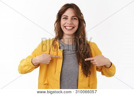 I What You Look For. Attractive Pleasant Smiling Happy Young Caucasian Curly-haired Girl Pointing He