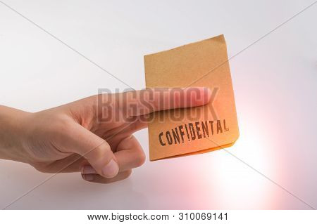Brown Paper  Text Confidental On A White Background