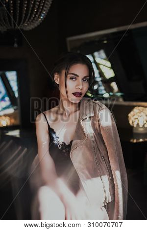 Young Beautiful Woman Mixed Race Posing In Seductive Lingerie And Suede Jacket. Fashion Photoshoot.