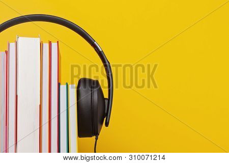 Group Of Books With The Earphones. Audiobooks. Listen And Study Concept.