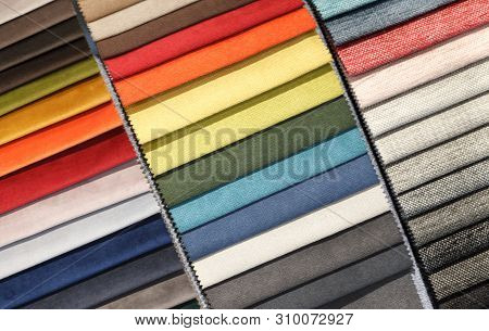 Multi-colored Samples Of Upholstery Fabric For Sofas And Chairs Close-up. Selection Of Fabric For In