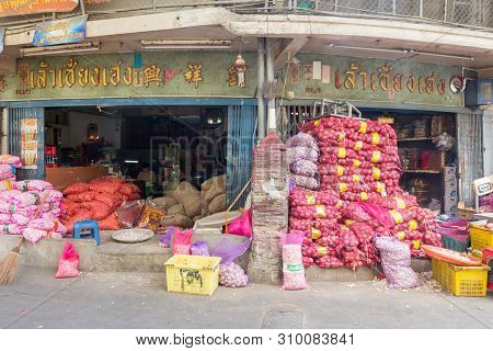 Bangkok, Thailand - July 9th 2015: Sacks Of Onioins And Garlic Piled Up Outside A Shop In Pak Khlong