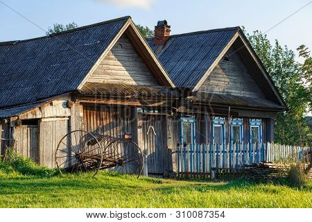Russian Village In Summer. Old Country House With A Wooden Fence. Village Of Visim, Sverdlovsk Regio