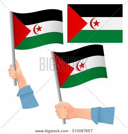 Sahrawi Arab Democratic Republic Flag In Hand. Patriotic Background. National Flag Of Sahrawi Arab D