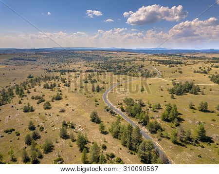 Sealed Winding Road Through Calcareous Limestone Karst Landscape Of Causse Noir In Cevennes France