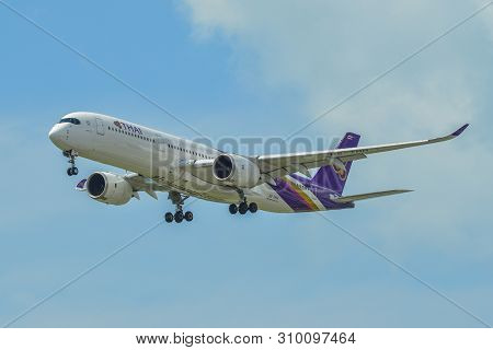 Airplane Landing At Singapore Airport