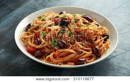 Pasta Alla Puttanesca With Garlic, Olives, Capers, Tomato And Anchois Fish