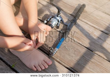 Fishing Line Got Tangled, A Big Knot, The Boys Hands Unravel The Knot, Concept