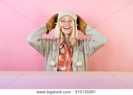 Beautiful Sexy Young Woman Holding Gold Leaf On Pink Background. Girl In Autumn Playing With Leaves 