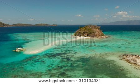 Aerial Seascape Tropical Island And Sand Beach, Turquoise Water And Coral Reef. Malacory Island, Phi