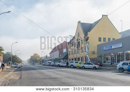 Standerton, South Africa - May 2, 2019: A Street Scene, With Businesses And Vehicles, In Standerton,