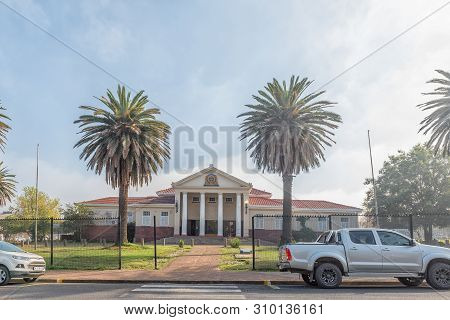 Standerton, South Africa - May 2, 2019: A Street Scene, With The City Hall And Vehicles, In Standert